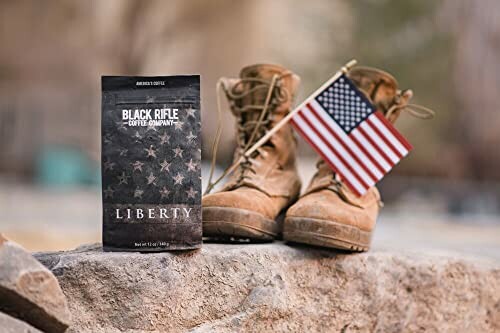 Coffee bag with boots and American flag on a rock.