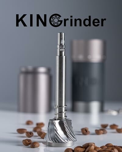 Metal coffee grinder burr with scattered coffee beans