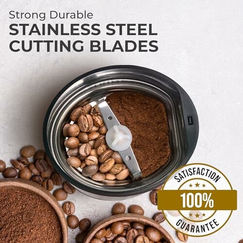 Coffee grinder with stainless steel blades, coffee beans, and ground coffee.